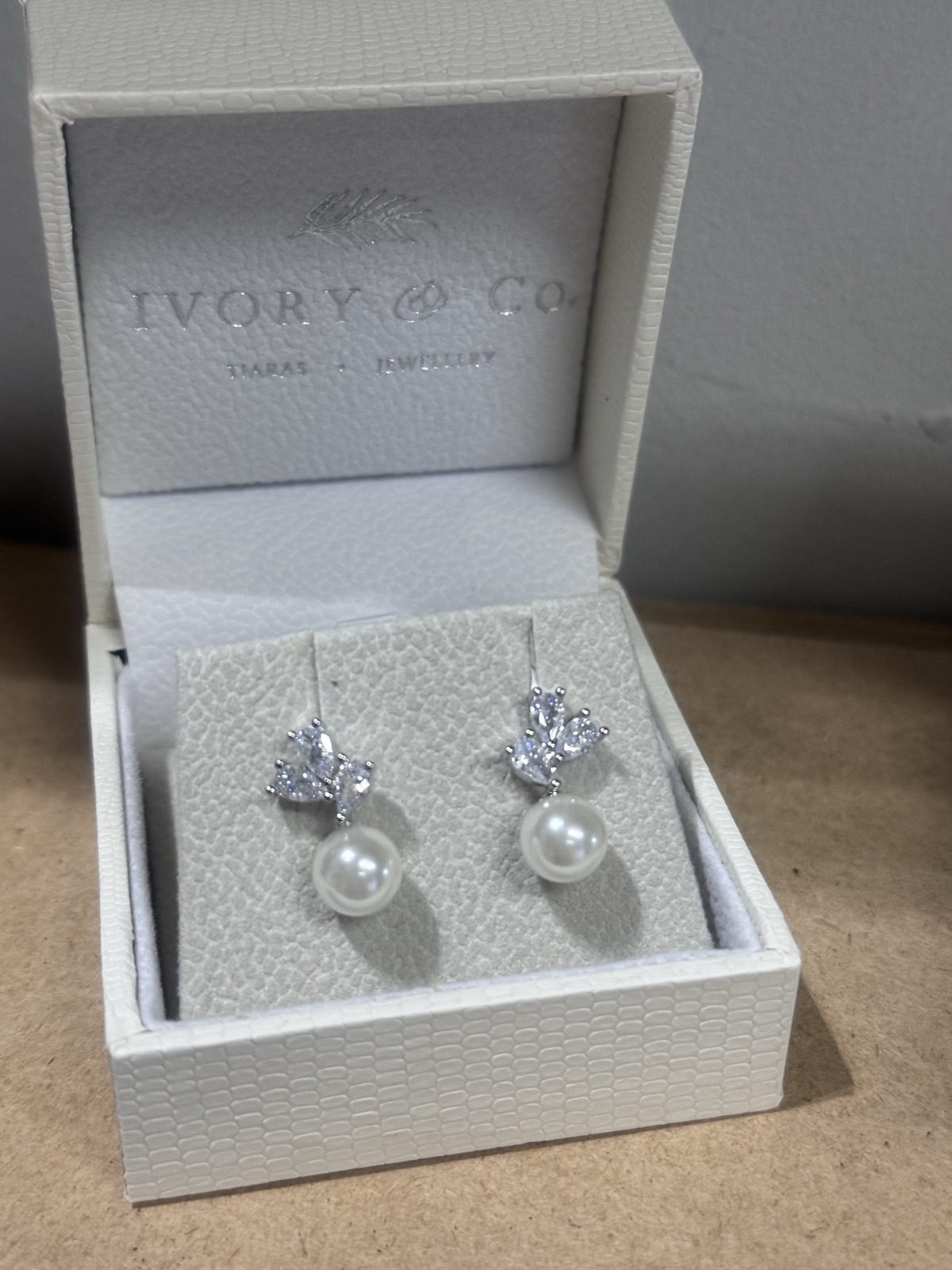 Pearl-drop bridal earrings with crystal detail in a presentation box